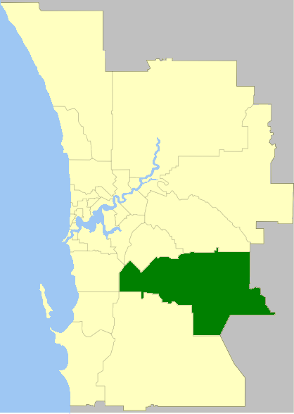 Map highlighting a region in dark green within a larger area marked in yellow. The region is located in the southeastern part of the map, which includes a coastline on the left.